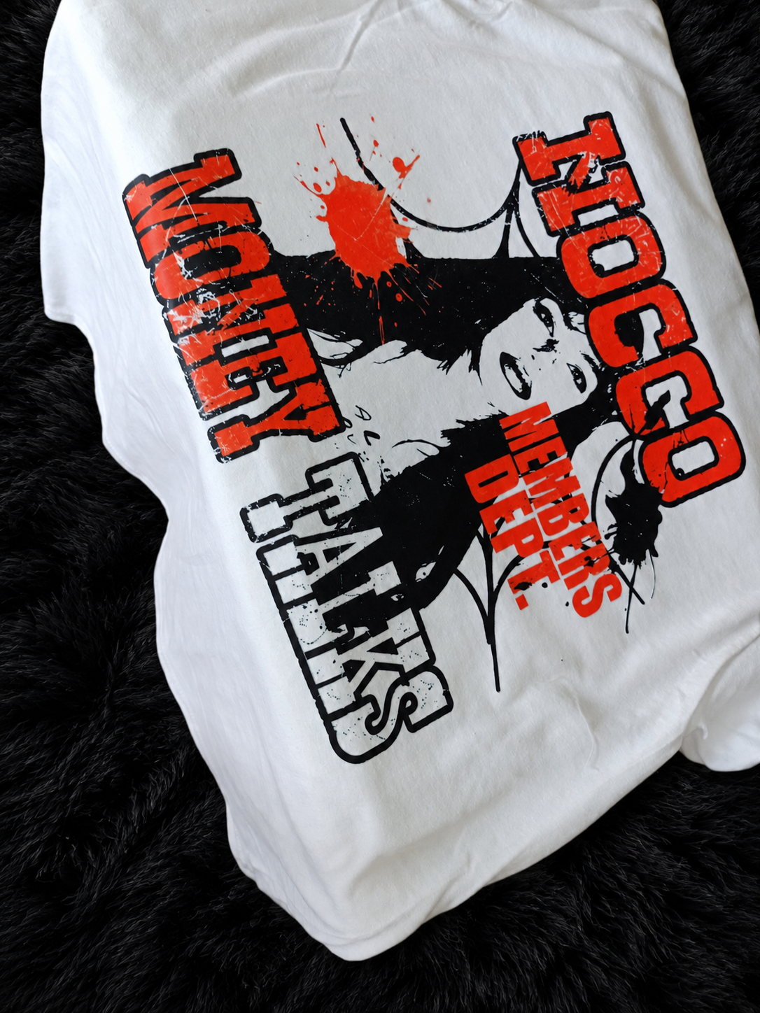 Custom red and black photo graphic shirt on a black plush rug