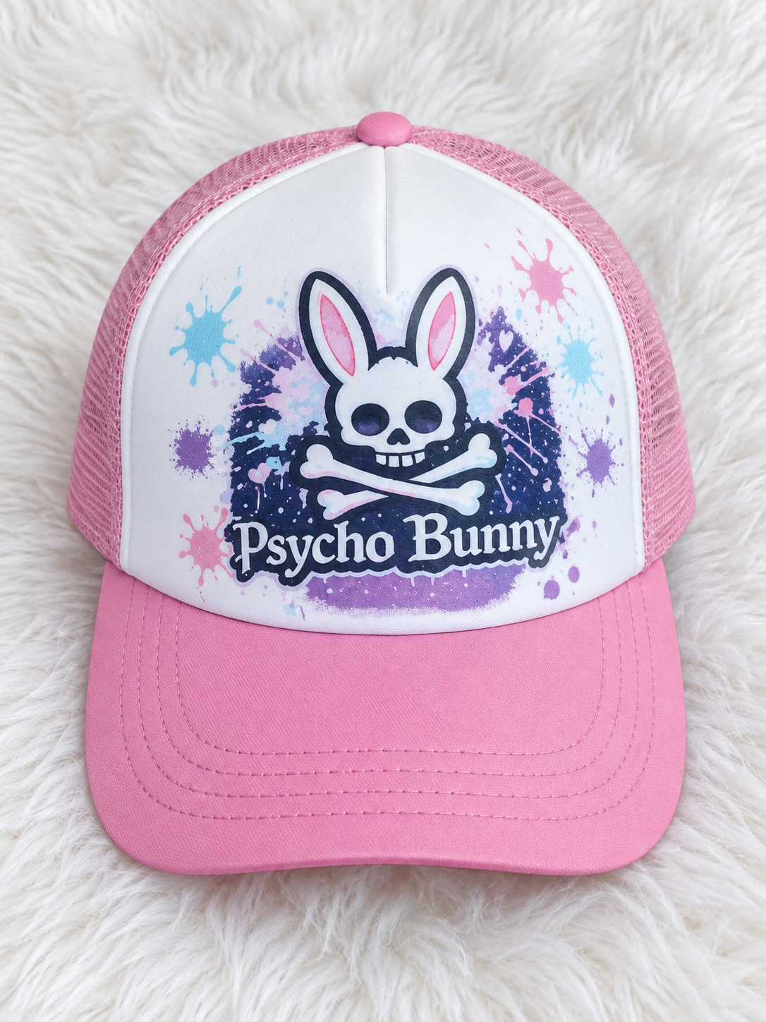 Pink Psycho Bunny custom hat on a white plush rug