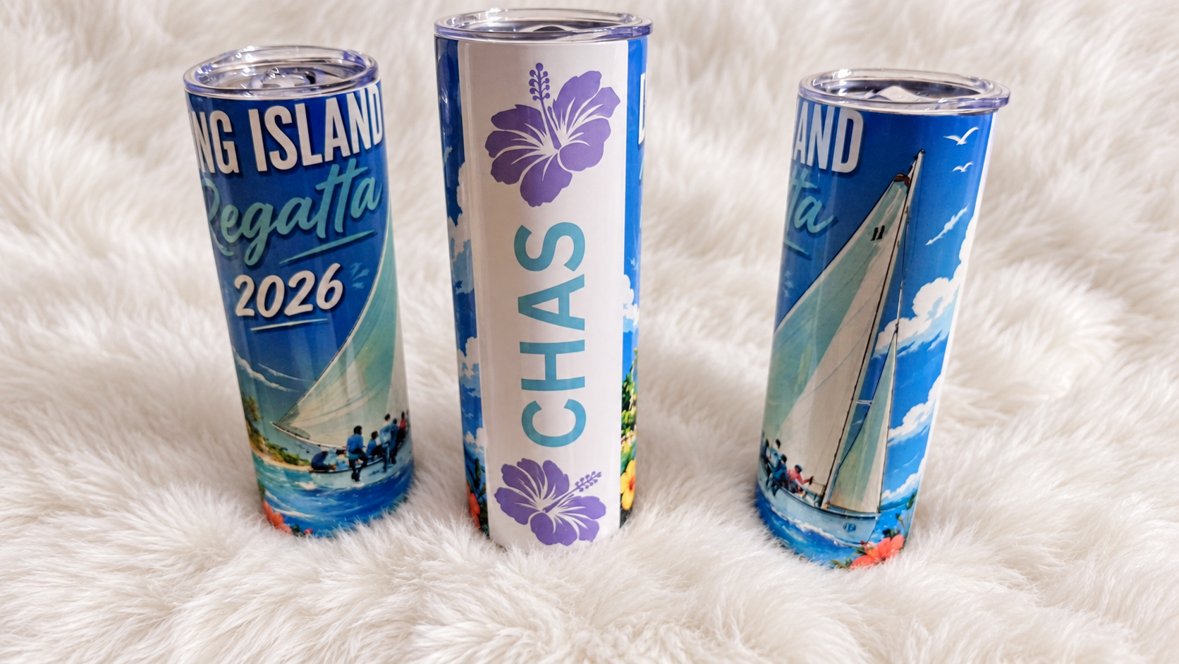 Three personalized Long Island Regatta and Bahamas tumblers on a white plush rug